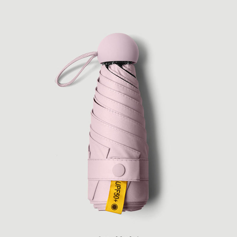 Bärbart kapselparaply med dubbel funktion