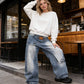 Damjeans med asymmetrisk midja och vida ben